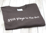 "Still Plays in the Dirt" Unisex T-Shirt